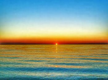 Scenic view of sea at sunset