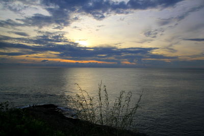 Scenic view of sea against sky at sunset