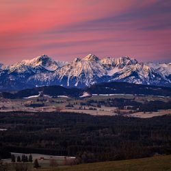 Scenic view of snow covered mountains