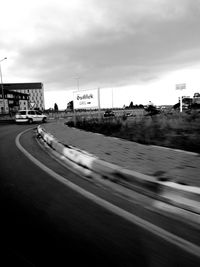 View of road against cloudy sky