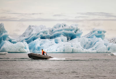 Boat in sea against sky