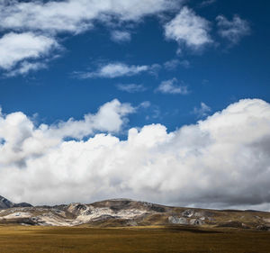 Scenic view of snowcapped mountains against sky