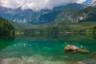 Scenic view of lake and mountains against sky