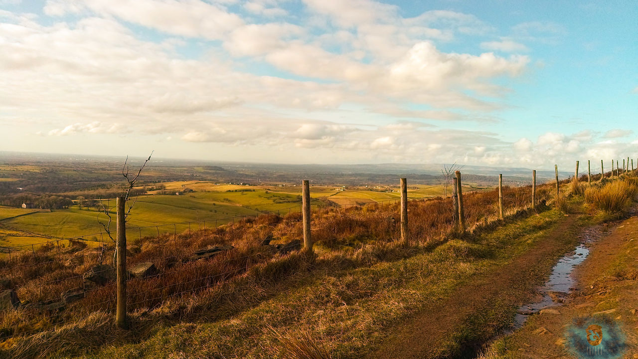 sky, cloud - sky, environment, landscape, tranquil scene, scenics - nature, beauty in nature, tranquility, land, non-urban scene, nature, barrier, no people, field, plant, boundary, grass, day, fence, rural scene, outdoors, wooden post