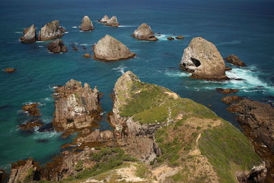 High angle view of rocks in sea