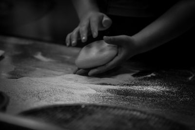 Low section of person preparing food