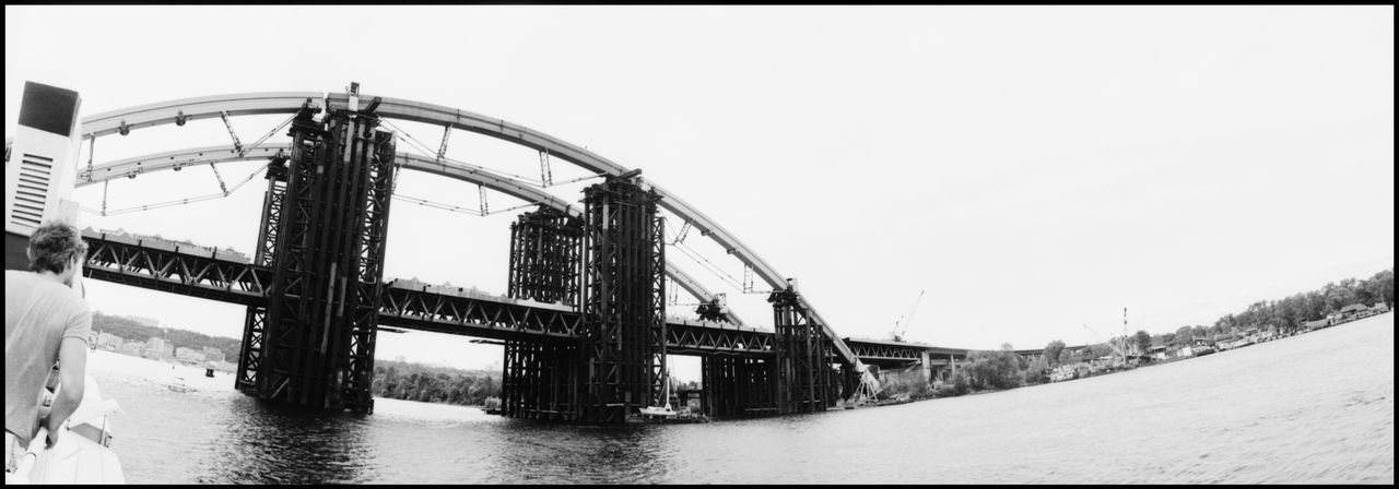 VIEW OF BRIDGE OVER RIVER AGAINST CLEAR SKY