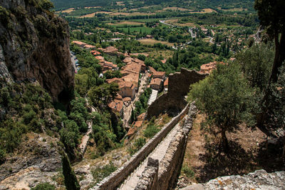 Stone path, roofs and belfry at the village of moustiers-sainte-marie, in the french provence.