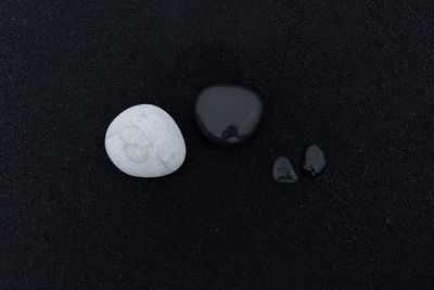 High angle view of pebbles on sand