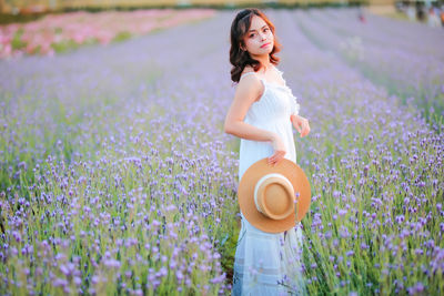 Full length of woman standing on field