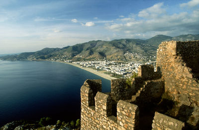 Scenic view of sea and buildings against sky