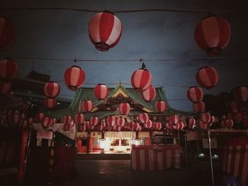 Low angle view of illuminated lanterns hanging on ceiling