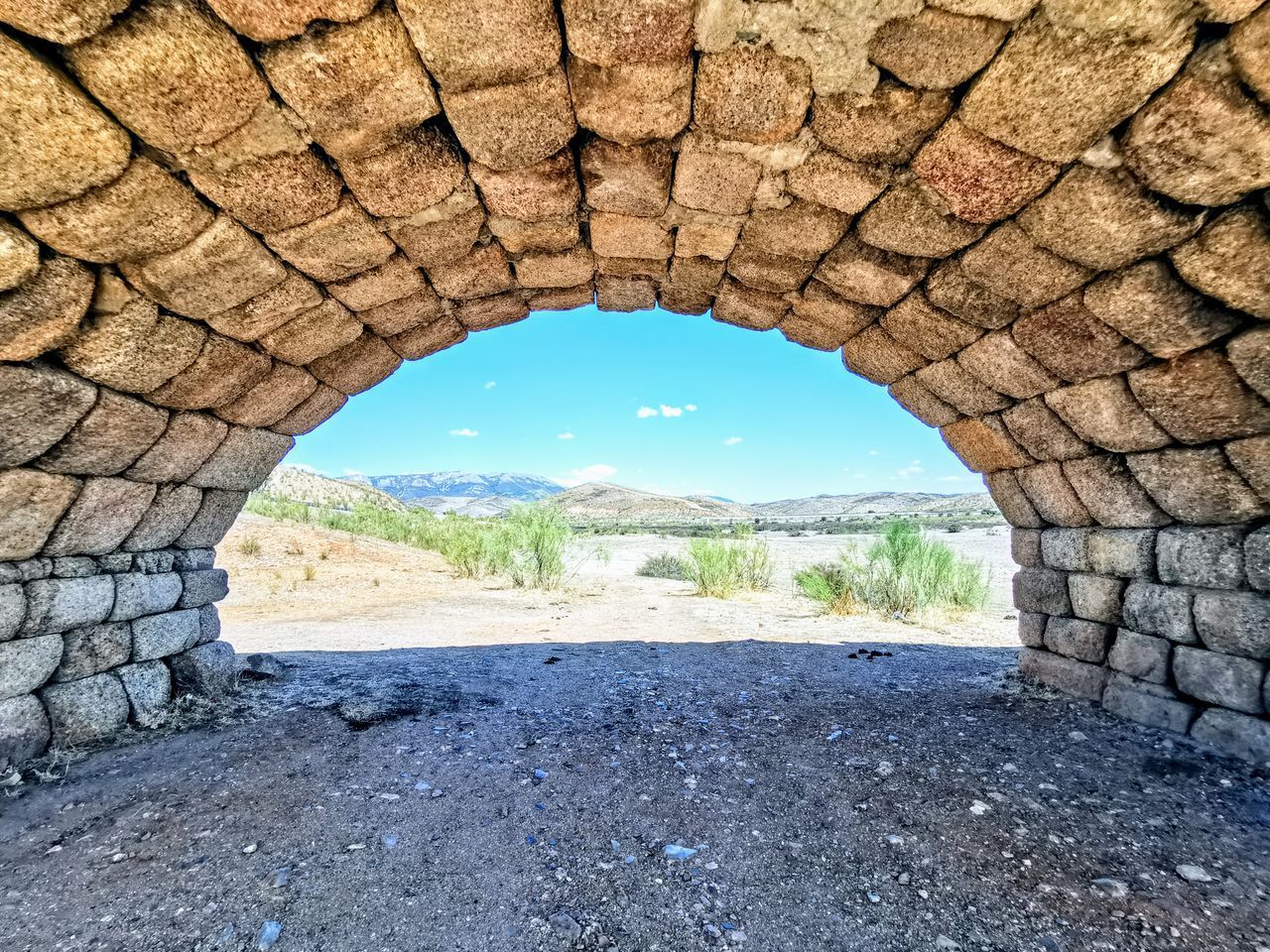 VIEW OF EMPTY THROUGH TUNNEL WALL