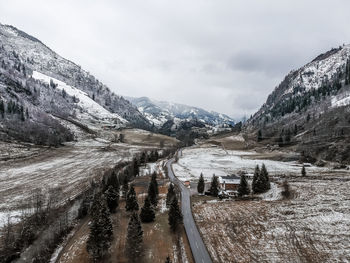 Scenic view of mountains against sky during winter