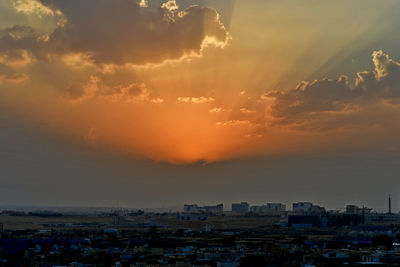 High angle view of buildings against sky at sunset