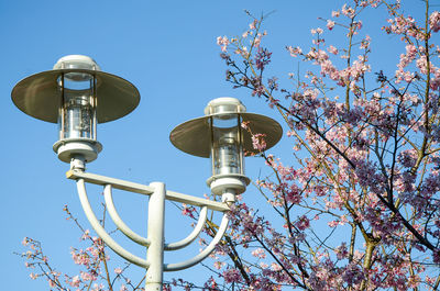 Low angle view of street light against sky