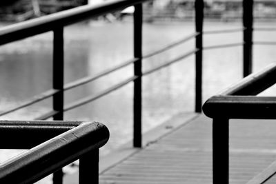 Close-up of metal railing on footpath