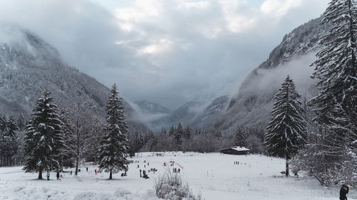 Scenic view of snow covered mountains against sky