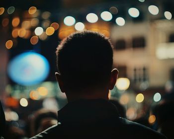 Defocused image of illuminated city at night