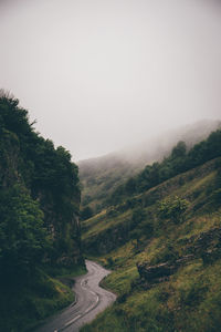 Country road leading towards mountains