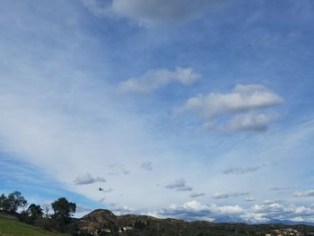 Low angle view of clouds over blue sky