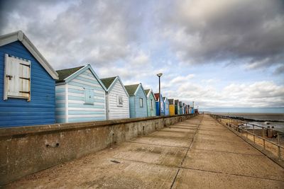 View of beach against cloudy sky