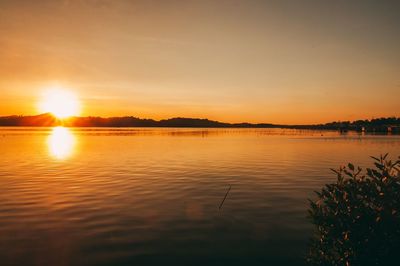 Scenic view of lake against sky during sunset