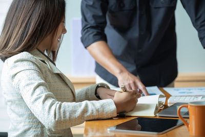 Businesswoman working at table