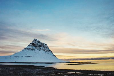 Scenic view of sea against sky during winter