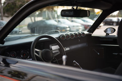 View of steering wheel and car dashboard