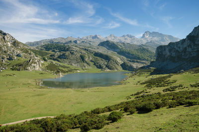 Scenic view of lake and mountains against sky