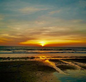 Scenic view of sea against sky during sunset