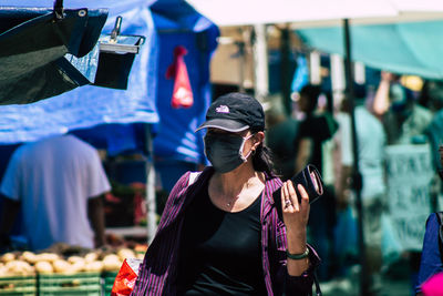 Rear view of woman using mobile phone