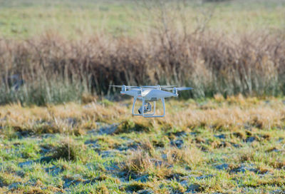 Drone flying over field