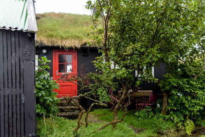 View of house with trees in background