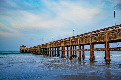 Pier over sea against sky
