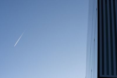 Low angle view of building against clear blue sky