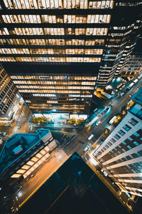 High angle view of illuminated buildings in city at night