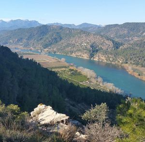 High angle view of calm river against mountain range