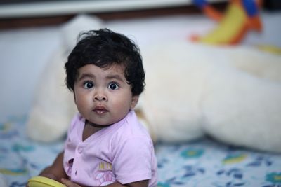 Portrait of cute baby girl at home