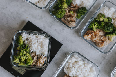 Weighing healthy lunch boxes as part of meal prep