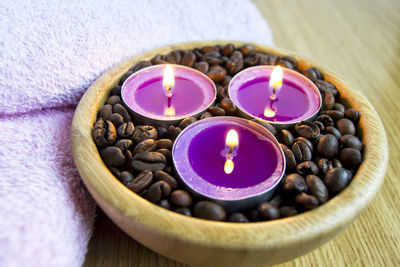 Candle lights with coffe beans for spa and christmas decoration concept