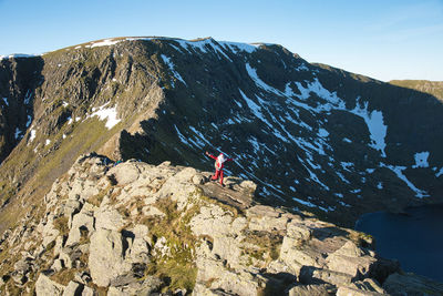 Santa running on a mountain