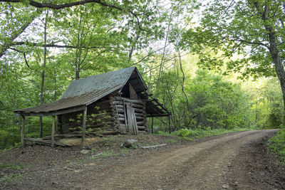 Built structure in forest against sky