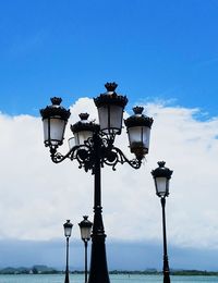 Low angle view of street light against sky