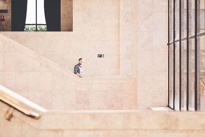 Full length of young woman in city