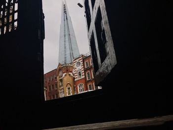 Low angle view of clock tower against sky