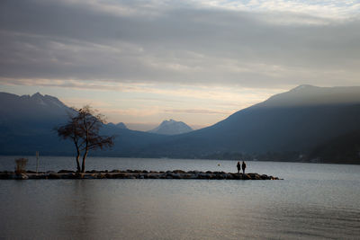 Scenic view of lake against sky during sunset