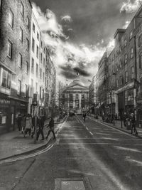 City street against cloudy sky