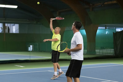 Men playing tennis